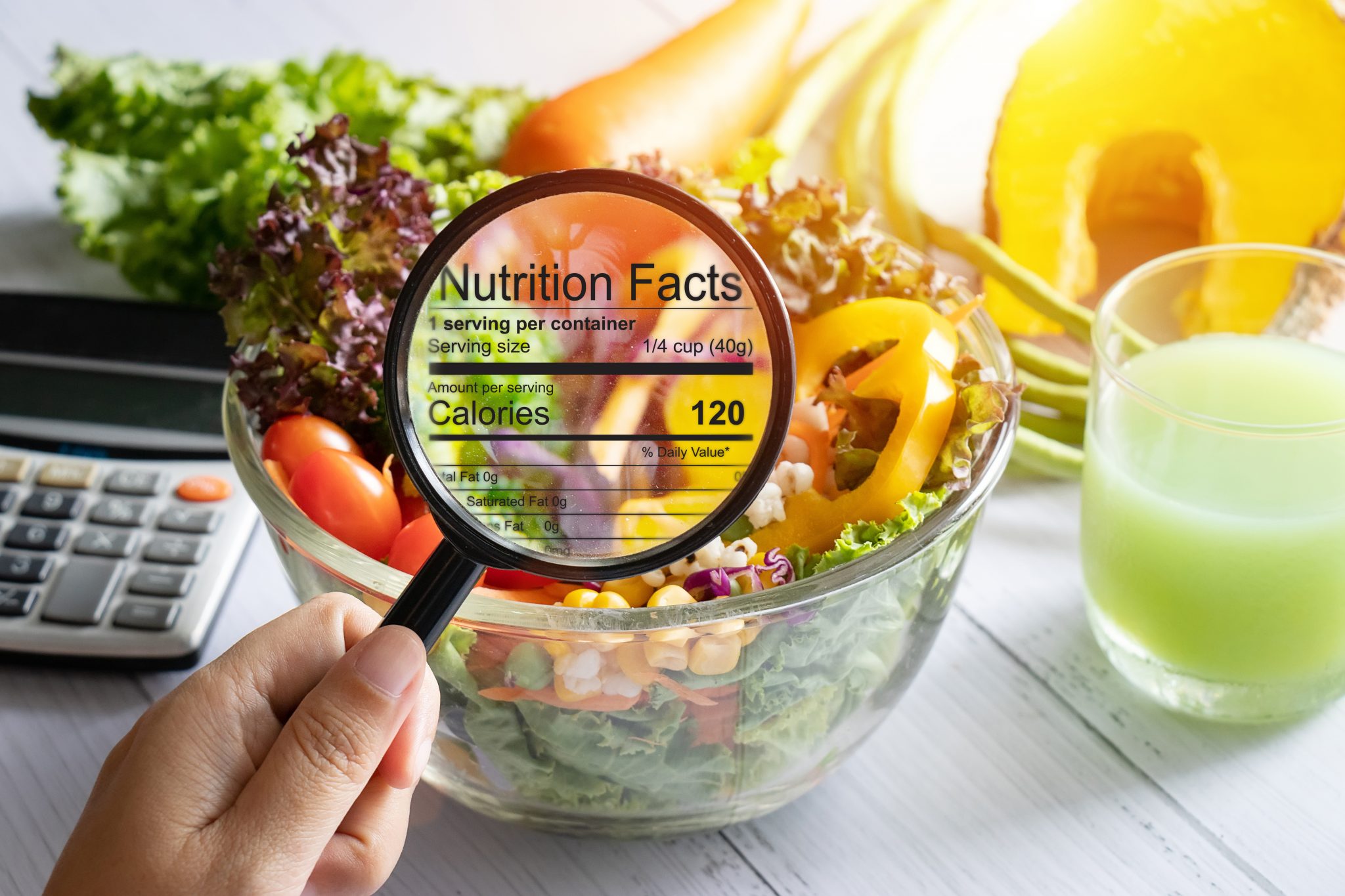 nutritional-information-concept-hand-use-the-magnifying-glass-to-zoom-in-to-see-the-details-of